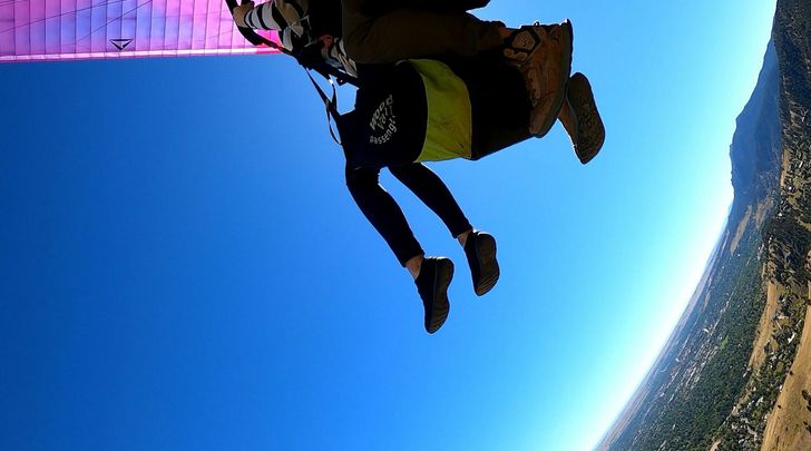 Tandem Paragliding Flight Over Boulder